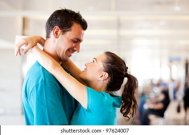 Loving Young Couple Say Good Bye At Airport