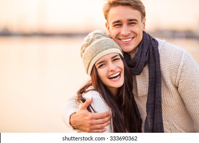 Loving young couple walk on the beach in autumn - Powered by Shutterstock