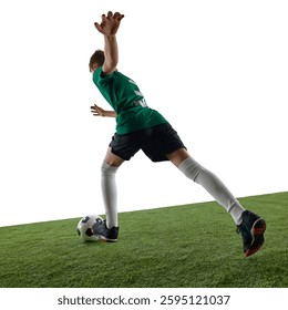Low angle back view image of teen boy, soccer player in green jersey and black shorts in motion on field, kicking ball against white background. Concept of sport, education, competition, game