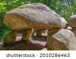 Low angle close up view of Dolmen (hunebed) D27 close to Borger in the Netherlands which is a megalithic tomb or burial mound with large stones dating back to Neolithic period, about 5.000 years ago