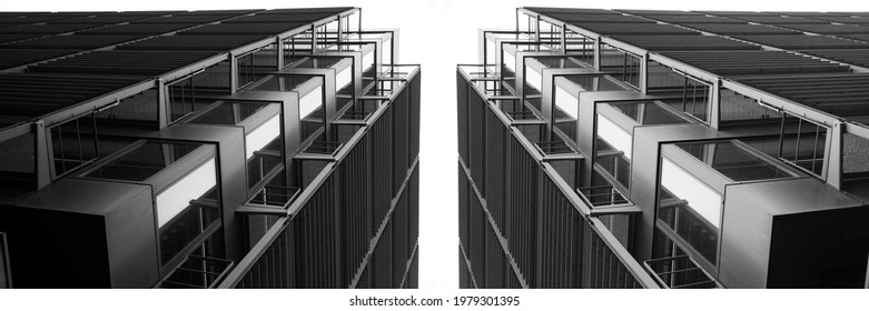 Low Angle Close-up Fragment Of Industrial Building With Lift Shaft And Perforated Panels. Modern Industry And Minimal Architecture Background With Modular Structure Of Glass And Metal Framework. 