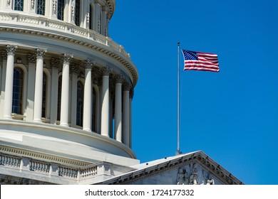 A low angle closeup of The United States Capitol under the sunlight and a blue sky in Washington DC - Powered by Shutterstock