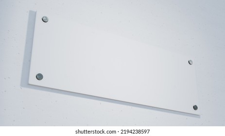 Low Angle Close-up View Of Blank Rectangle Nameplate Mounted On Clean White Wall, Copy Space. Unaltered, Shape, No People, Communication.