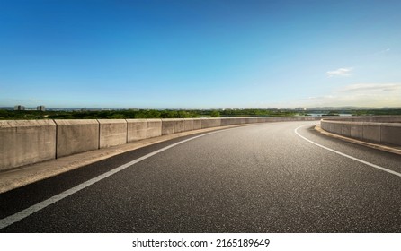 Low Angle Curvy Flyover Highway Moving Forward Road With Nature Blue Sky Scape Morning Scene View.