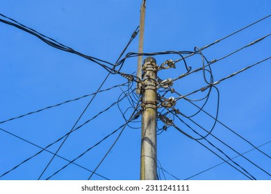 Low angle electric poles in Indonesia with a clear sky as a background - Shutterstock ID 2311241111