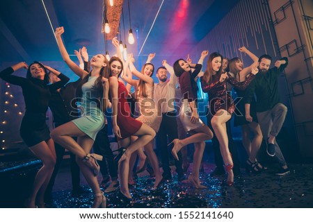 Low angle full size view photo of positive cheerful youth people party hard on discotheque dance moving feel crazy rejoice wild in nightclub