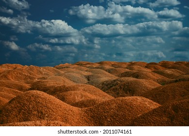 Low Angle Horizon Landscape Of Mound And Dirt Road. Earthwork Ground With Sky Background View