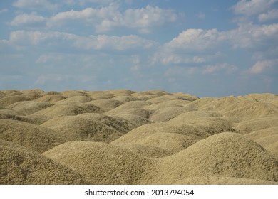 Low Angle Horizon Landscape Of Mound And Dirt Road. Earthwork Ground With Sky Background View