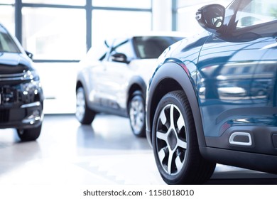 Low Angle Of Luxurious Car In A Exclusive Showroom With Vehicles