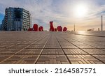 Low angle perspective of the waterfront promenade in Oostende (Ostend) at sunset by the North Sea, Belgium.