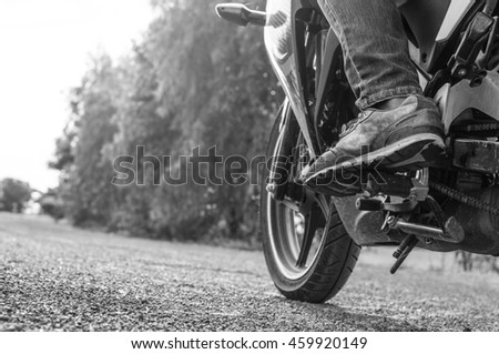 Similar – Couple sitting over motorcycle ready to go