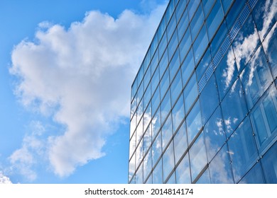 Low Angle Photography Of Glass Curtain Wall Details Of High-rise Buildings.The Window Glass Reflects The Blue Sky And White Clouds