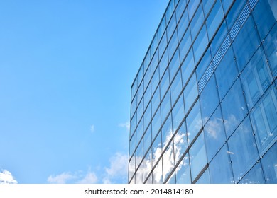 Low Angle Photography Of Glass Curtain Wall Details Of High-rise Buildings.The Window Glass Reflects The Blue Sky And White Clouds