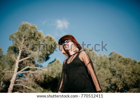 Similar – Image, Stock Photo Happy blonde woman with sunglasses and a hat enjoying the sun in nature