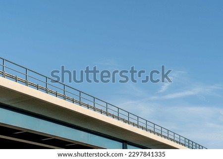 A low angle shot of the A45 stone bridge under a blue sky in Wetzlar, Germany