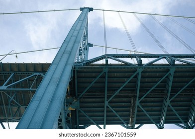 A low angle shot of the Ambassador suspension bridge under the blue sky - Powered by Shutterstock