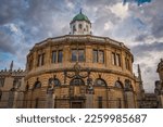 A low angle shot of the Bodleian Libraries under a cloudy sky in Oxford, England, UK