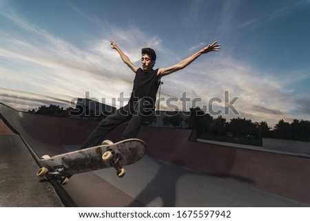 Similar – Beautiful young photographer sitting on the ground with the camera in the country