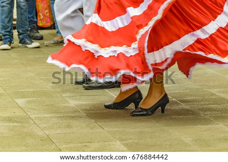 Low angle shot of dancers feets with typical costume dancing traditional ecuadorian music at Bucay city, Ecuador