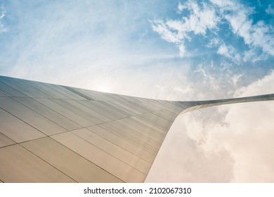 A Low Angle Shot Of The Gateway Arch In St  Louis Against A Cloudy Sky On A Sunny Day In The USA