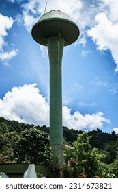 A low angle shot high   tall water tank tower in Thailand