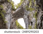 A low angle shot of the Natural Bridge rock formation at Natural Bridge State Park, Virginia