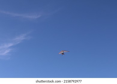 A Low Angle Shot Of People Hang Gliding In Baja California Beach, Mexico