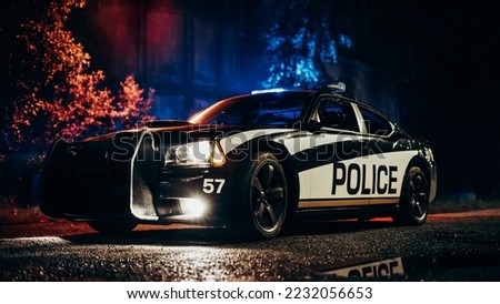 Low Angle Shot of a Stopped Police Car with Lights on and Sunset in the Background. Patrolling Vehicle on Stand by, Waiting for Orders to Start Pursuing Suspects. Police Enforcement Concept