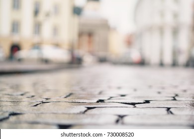 Low Angle Shot Of Wet Old Pavement In Tallinn With Shallow Focus