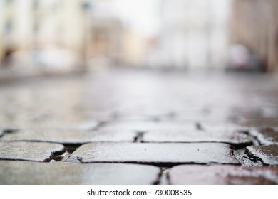 Low Angle Shot Of Wet Old Pavement In Tallinn With Shallow Focus