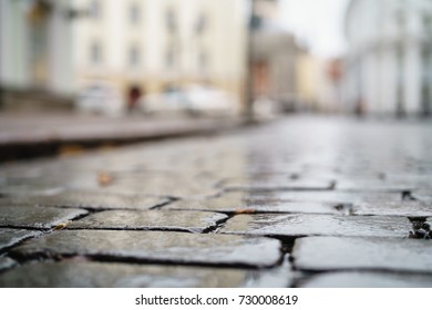 Low Angle Shot Of Wet Old Pavement In Tallinn With Shallow Focus