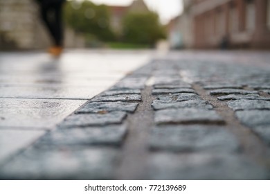 Low Angle Shot Of Wet Old Pavement In Tallinn