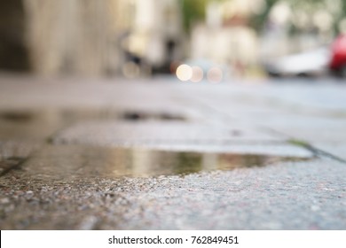 Low Angle Shot Of Wet Pavement In Tallinn