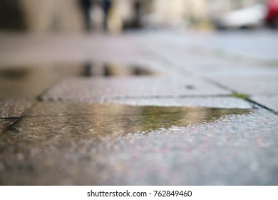 Low Angle Shot Of Wet Pavement In Tallinn