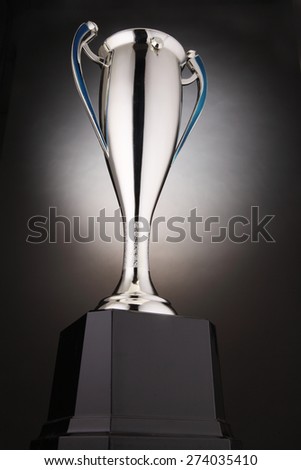 low angle of trophy with glow at the background