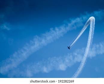 Low angle view of an airplane performing airshow