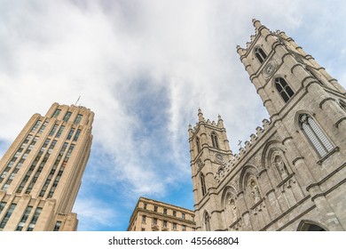 Low angle view of Aldred Building and Notre-Dame Basilica of Montreal