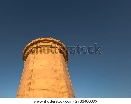 Low angle view of ancient marble columns and architrave against deep blue sky at Knidos Ancient City, Datca, Turkey