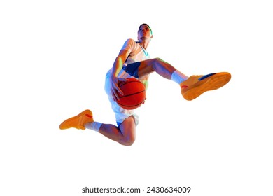 Low angle view. Athletic man in mid-jump shot with basketball ball against white studio background in neon light. Concept of professional sport, energy, strength and power, championship, tournament. - Powered by Shutterstock