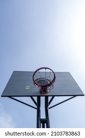 Low angle view of basketball hoop under the morning sunlight