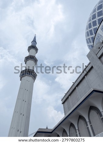 Low angle view of the Blue Mosque featuring its iconic dome and minaret, representing Islamic architecture, religion, culture, worship, and spiritual heritage concepts.
