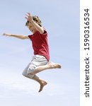 Low angle view of boy jumping