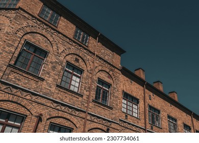 Low angle view of brick building against the sky  - Powered by Shutterstock