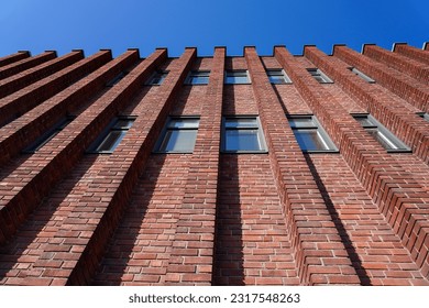 Low angle view of brick building against clear blue sky - Powered by Shutterstock