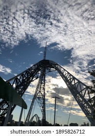 Low angle view of a bridge with a cloudy sky