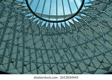 The low angle view of the building ceiling. Interior of modern architecture, modern city building. Interior design. Details of modern architecture. Building abstract. Building background.