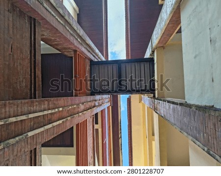Low angle view of building corridor with connecting bridge
