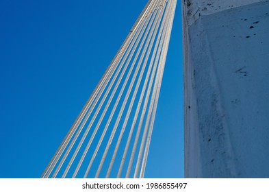 Low angle view of cable-stayed bridge against sky
