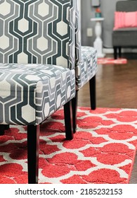 Low Angle View Of Chair, Rug And Hardwood Floor.The Design Elements Are Contrasting But Complementary Geometric Patterns 