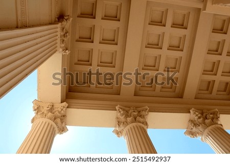 Low Angle View of Classical Columns and Ornate Ceiling Design – Architectural Detail